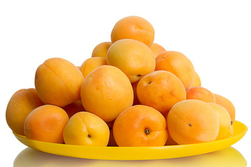 Heap apricot on the yellow plate