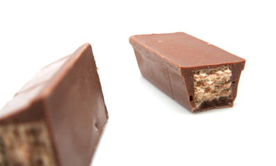 two candy bar pieces isolated on white