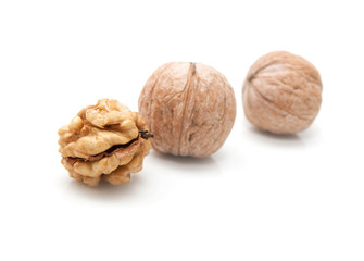 Crushed walnuts on white background