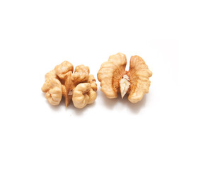Crushed walnuts on white background