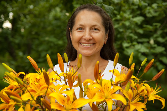 gardenerwith bouguet of  lilies