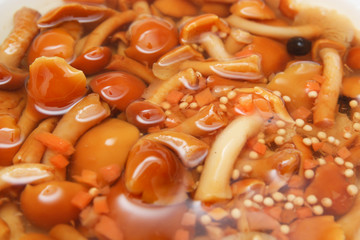 Marinated mushrooms in the background