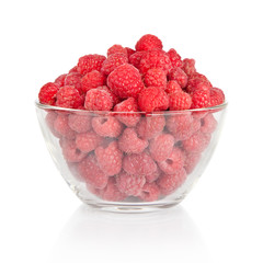 fresh raspberries in a bowl isolated on white