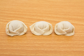 homemade meat dumplings on a cutting board