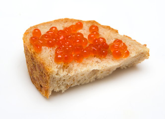 close-up red caviar on bread isolated on white background