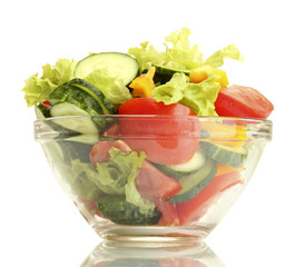 fresh vegetable salad in transparent bowl isolated on white