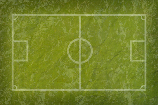 Soccer football on grass paper field