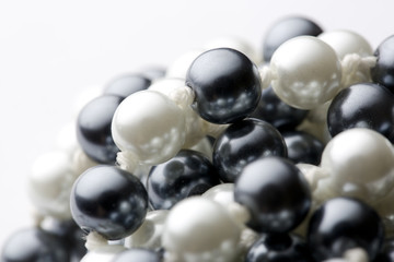 String of black and white pearls