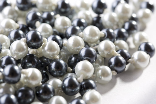 String of black and white pearls