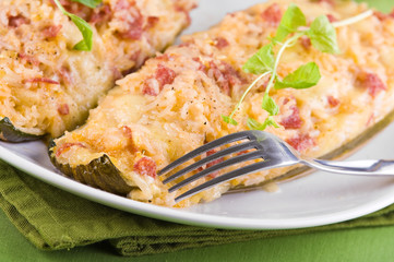 Stuffed zucchini halves.