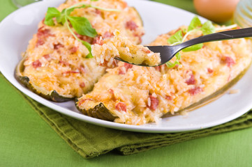 Stuffed zucchini halves.