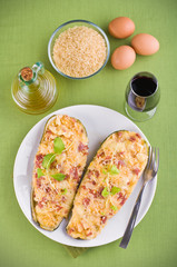 Stuffed zucchini halves.