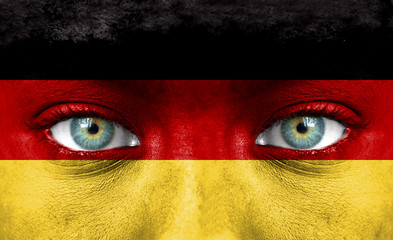 Human face painted with flag of Germany