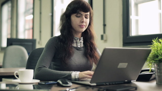 Young attractive businesswoman having headache