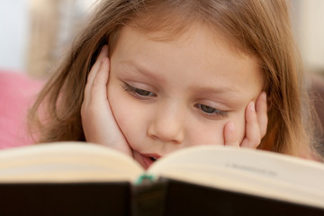 child reading a book