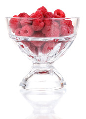 Raspberries in glass isolated on white