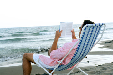 Young guy relaxing at the beach
