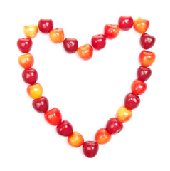 red and yellow cherries in shape of heart