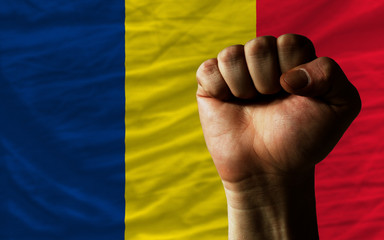 Hard fist in front of chad flag symbolizing power