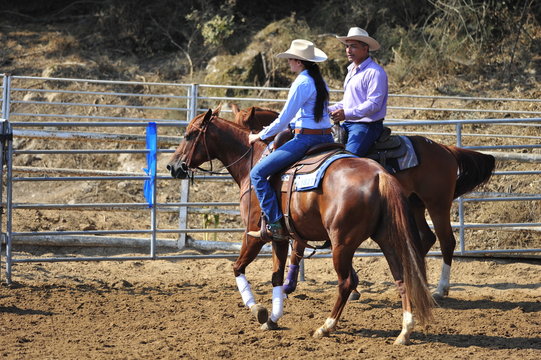 Young woman is riding a horse
