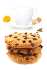 Biscuits with chocolate, coffee beans and a cup of coffee.