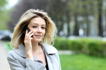 portrait of young woman talking on mobile phone