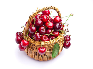 Delicious sweet cherry fruits in wicker basket