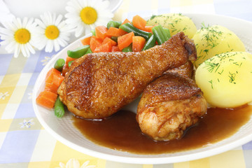 Chicken leg with vegetables and sauce