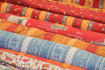 Rolls of Provencal textile on a market stall