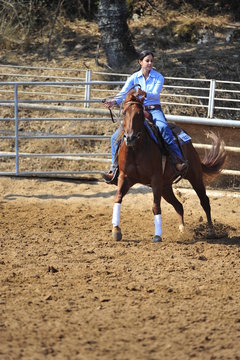 Girl riding a horse in competition