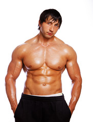 Portrait of sexy man posing in gym