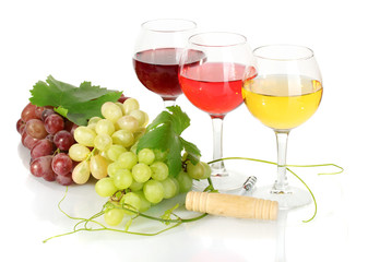 glasses of wine and ripe grapes isolated on white