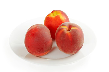 Three fresh nectarines