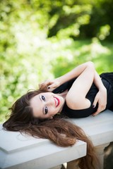 Fototapeta premium Beautiful woman lying down outdoors
