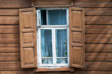 Obraz na płótnie Canvas Window of old wooden house.