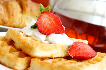 Tasty breakfast - tea, croissants, wafers