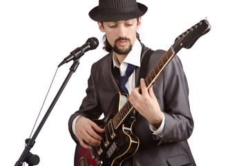 Naklejka premium Businessman playing the guitar on white