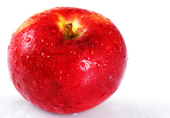 Bright red apple with water drops