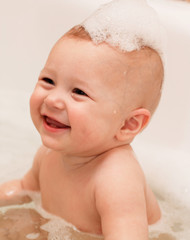 Adorable bath baby with soap suds