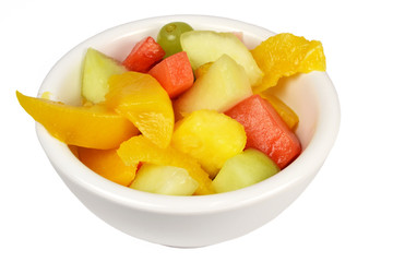 Naklejka na ściany i meble Fruit salad in a bowl on a white background.