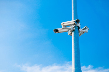 security cctv cameras on blue sky