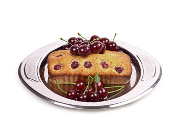 Delicious homemade cake with black cherries on a metal tray