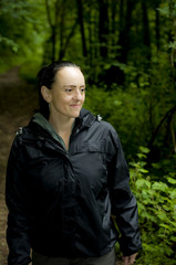 smiling woman in woodland