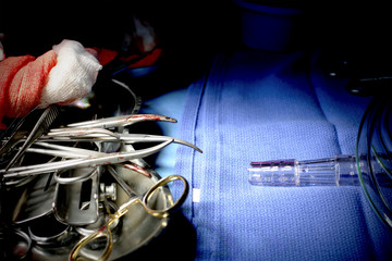 bloodied instruments, gauze after the surgery.