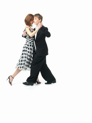 young couple dancing the tango, white background © Daco