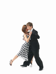 young couple dancing the tango, white background
