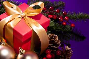 Red present box in a Christmas setting close up shoot