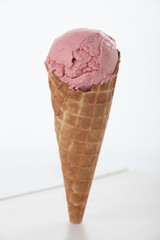 Single cone of pink ice-cream