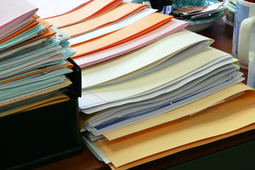 Paperwork piled on a desk