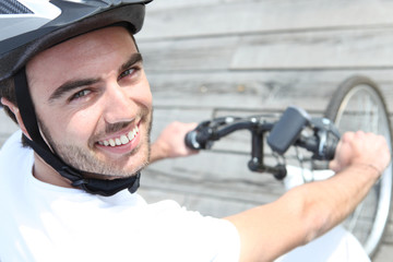 young man riding bike